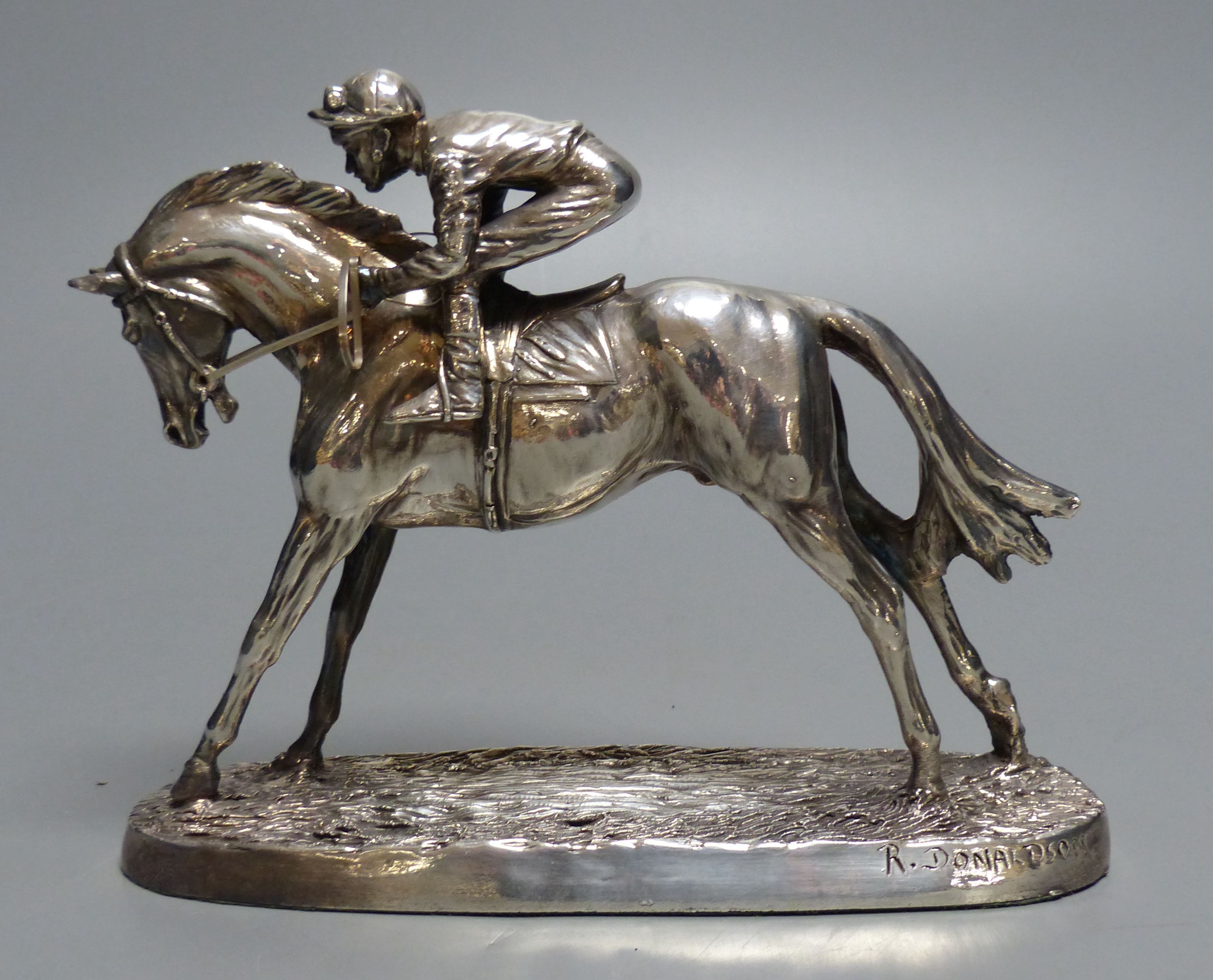 A modern silver mounted model of a racehorse and jockey, after R. Donaldson